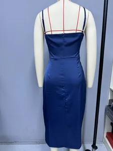 Rear view of navy blue satin slip dress featuring invisible zipper and adjustable straps