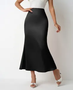 Elegant close-up of a black satin mermaid midi skirt showing smooth fabric texture and fit