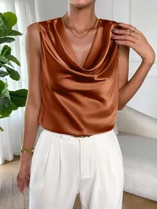 Close-up of a bronze satin sleeveless blouse with an elegant cowl neck drape.