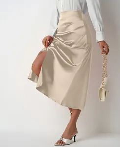 Close-up view of elegant champagne high-waisted satin midi skirt with chic side slit detail