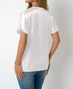 Back view of a white satin short sleeve blouse with loose fit and silk-like texture