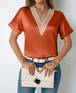 Close-up view of elegant V-neck satin blouse featuring intricate lace trim detailing
