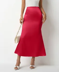 Close-up view of elegant red satin mermaid midi skirt with smooth silky texture.