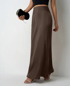 Close-up of elegant brown satin maxi skirt featuring a smooth and luxurious silky finish