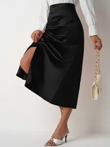 Elegant black high-waisted satin midi skirt with side slit and pleated detailing