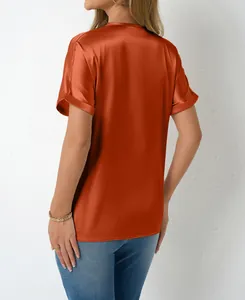 Back view of elegant terracotta satin short sleeve blouse featuring smooth silky texture
