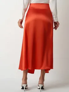 Elegant burnt orange high-waist satin maxi skirt with side slit back view for women