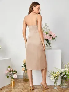 Detailed back view of a champagne satin slip dress showing thin straps and smooth fabric.