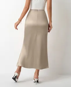 Back view detail of a champagne satin midi skirt showing sleek fit and fishtail hem