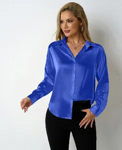 Macro detail of the royal blue satin fabric texture on women's V-neck button-down shirt.