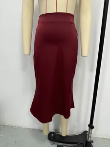 Close-up detail of a wine red satin midi skirt fabric texture on a mannequin torso