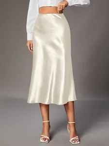 Elegant champagne satin midi skirt with a silky finish and flowing drape for women