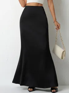 Elegant black satin high-waisted maxi skirt for women in a minimalist fashion style