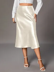 Elegant champagne satin midi skirt featuring a high waist and premium silky sheen finish.