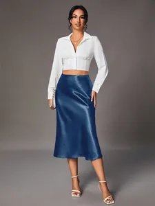 Full-body view of an elegant navy blue satin midi skirt with a silky finish on a model