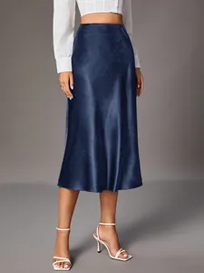 Detail of navy blue satin midi skirt with elegant high-waist design and premium silk-like texture