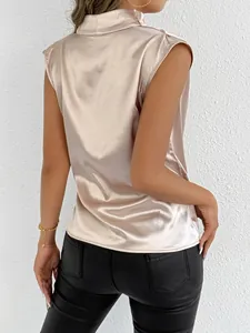 Back view of a champagne satin sleeveless blouse featuring a stylish mock neck design