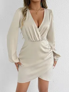 Elegant champagne satin V-neck dress with ruched details and lantern sleeves