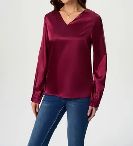 Elegant burgundy long-sleeved satin blouse featuring a sophisticated V-neck detail.