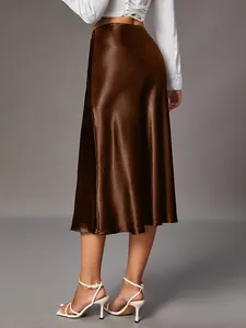 Detail view of brown satin midi skirt showing the high-quality silky fabric sheen