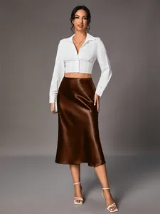 Elegant brown satin midi skirt featuring a high-gloss finish and sophisticated silk-like drape