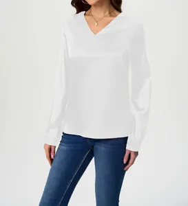 Elegant white long-sleeve satin blouse with V-neck showing silky texture and fit