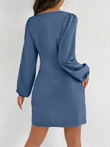 Elegant back view of a dusty blue satin long-sleeved mini dress with a slim fit silhouette