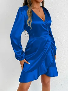 Elegant royal blue satin wrap dress with long sleeves and ruffled hem details