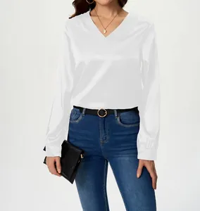Detail view of a white satin long-sleeve blouse with a classic V-neckline for women.