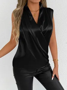 Close-up detail of a black elegant satin sleeveless blouse with a draped V-neck.