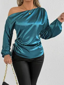 Detailed view of teal blue satin long sleeve off-shoulder blouse with side ruching detail