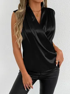 Close-up of black satin sleeveless wrap shirt featuring elegant draped silken texture.