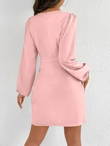 Detailed back view of pink satin mini dress with long puff sleeves and back zipper.