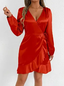 Detailed view of elegant red satin long sleeve wrap dress with stylish ruffle hem design