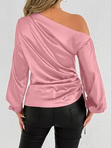 Back view of pink satin one-shoulder long sleeve blouse with gathered waist detail
