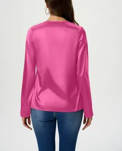 Detailed back view of a vibrant pink long-sleeved satin blouse with a premium silky sheen