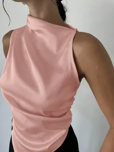Close-up detail of a pink satin sleeveless top with elegant draped high neckline