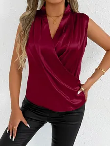 Detailed view of burgundy satin sleeveless wrap top showing silk-like texture and drape