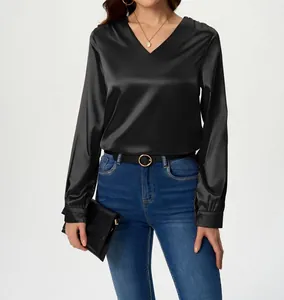 Detailed view of an elegant black long-sleeve satin blouse featuring a V-neck design.