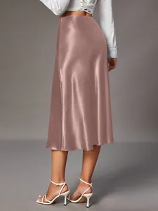 Back view of elegant rose gold satin midi skirt with high-waist silk-like texture