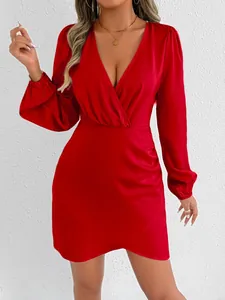 Close-up of elegant red satin mini dress with deep V-neck and long puff sleeves