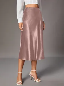 Detailed view of elegant mauve satin midi skirt with a smooth silky texture and high waist