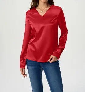 Detail view of a luxury red satin long sleeve blouse with a stylish V-neck design.