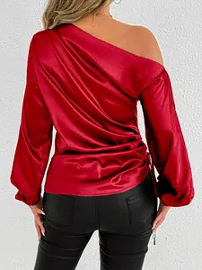 Detailed back view of an elegant red satin long sleeve off-the-shoulder blouse.