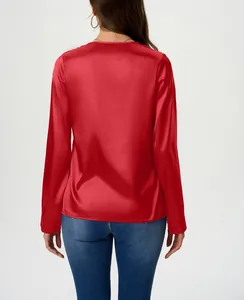 Detailed back view of a red long-sleeve satin blouse with a smooth glossy texture for women