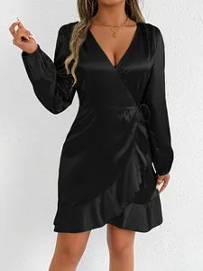 Elegant black satin wrap dress with long sleeves and ruffled hem detailing for women.