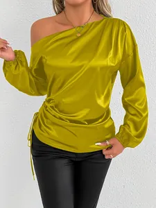 Elegant mustard yellow one-shoulder satin blouse with long sleeves and drawstring detail.