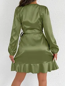 Back view of an olive green long-sleeved satin dress with ruffled hem and waist tie detail.