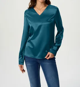 Close-up detail of women's teal long-sleeved satin shirt featuring elegant V-neckline