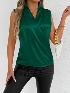 Close-up detail of elegant dark green satin sleeveless blouse featuring a wrap V-neck design